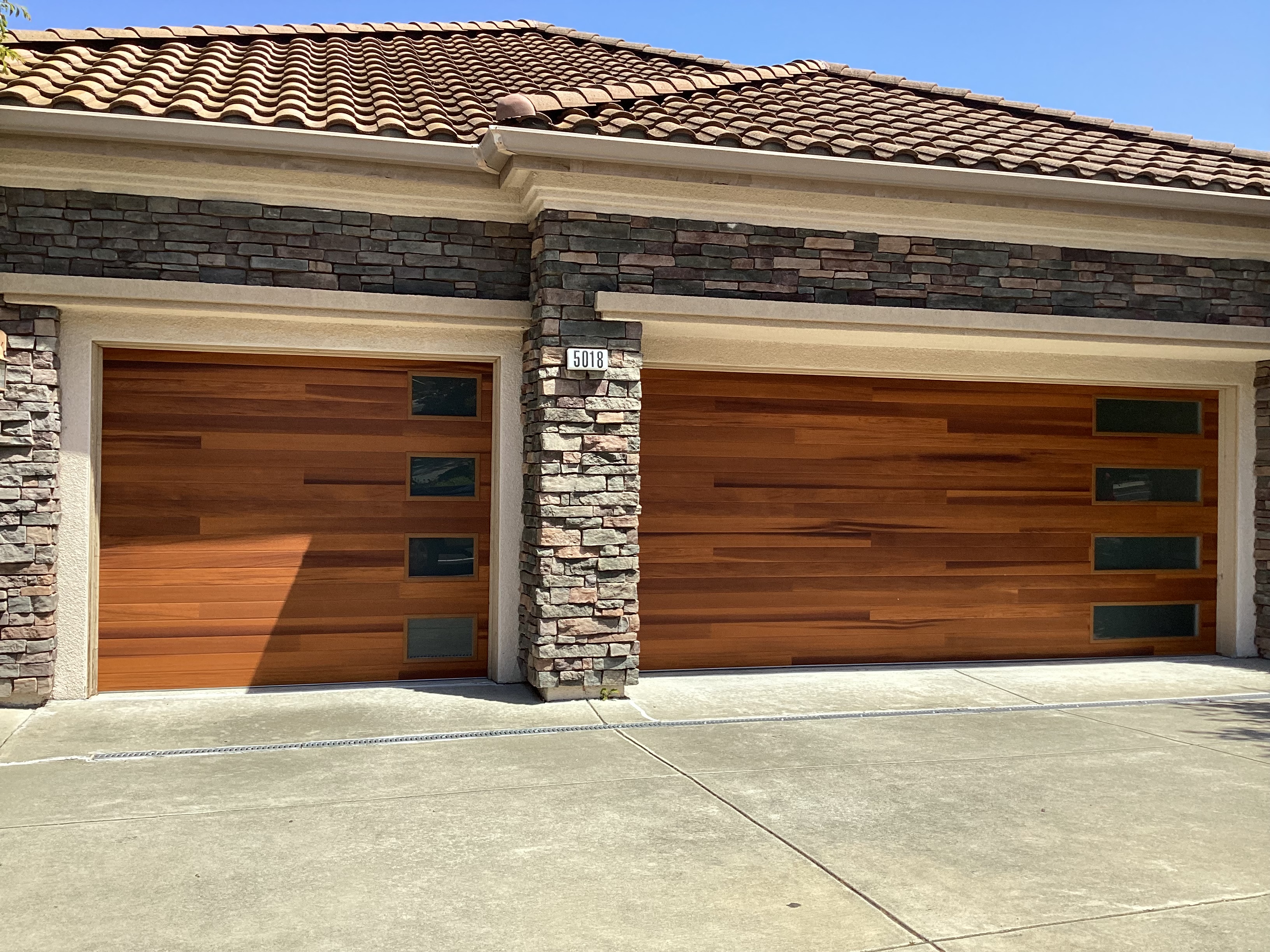 After modern wood-look garage doors