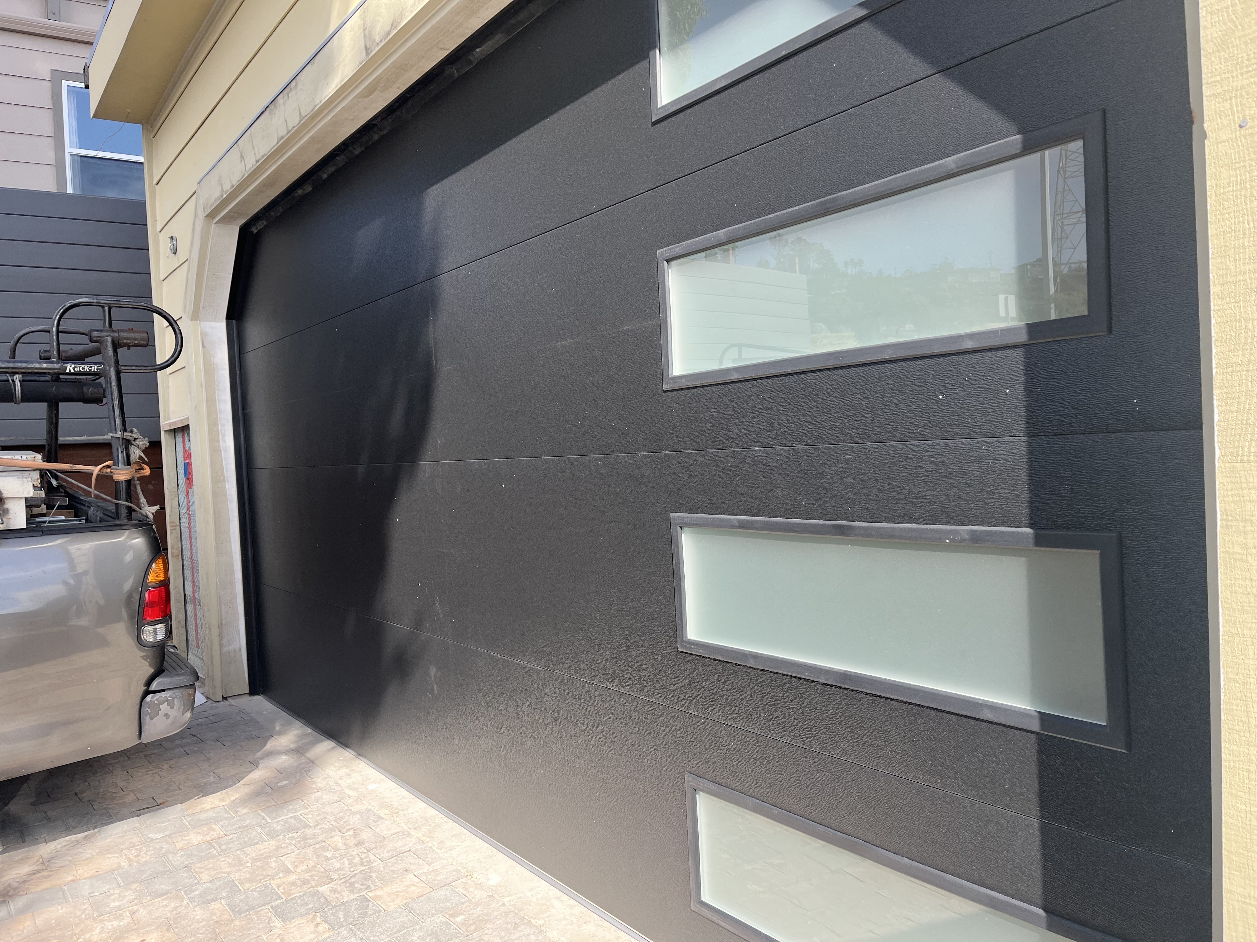 After modern black garage door installation