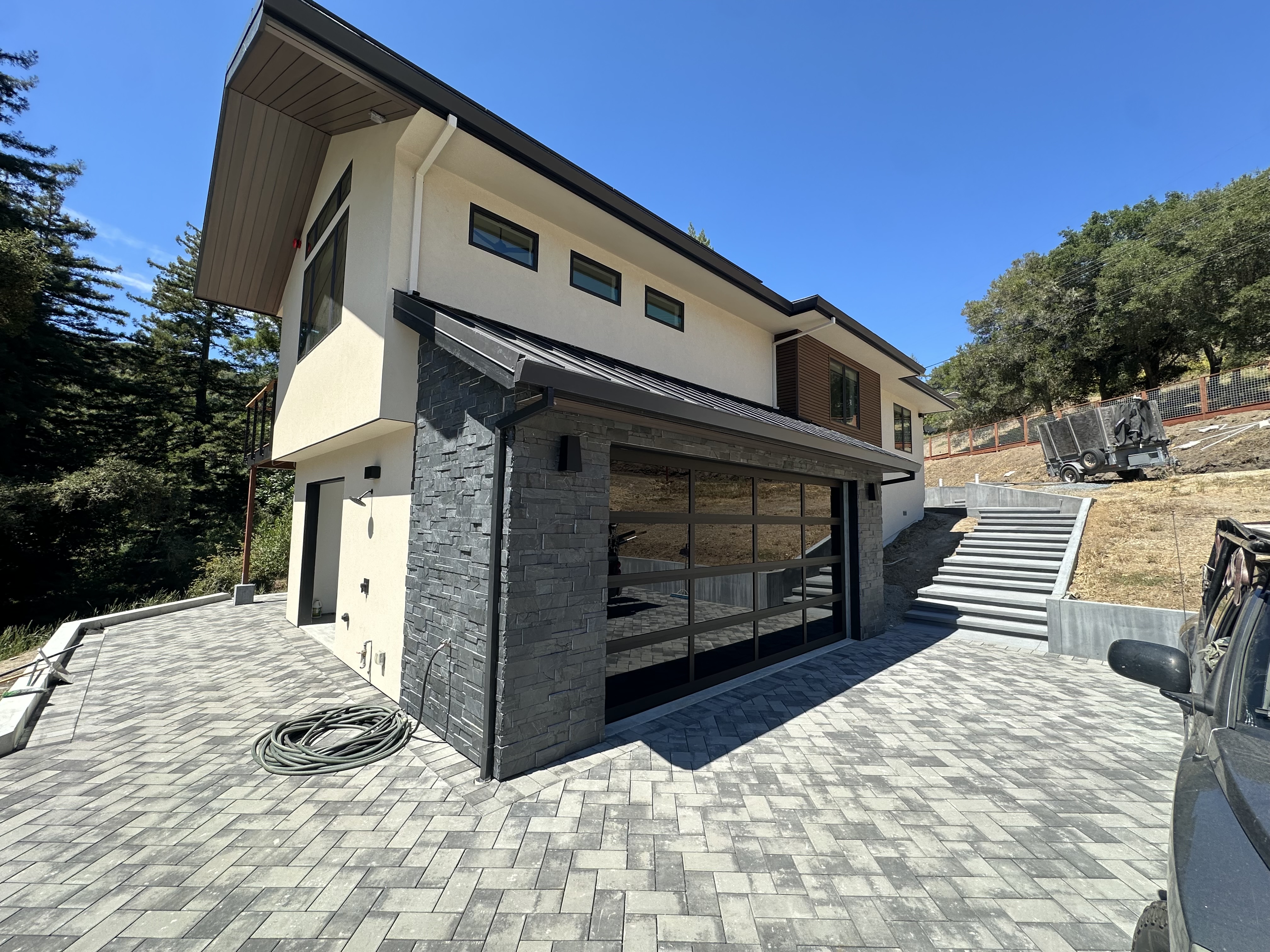 After modern full-view glass garage door on a custom home